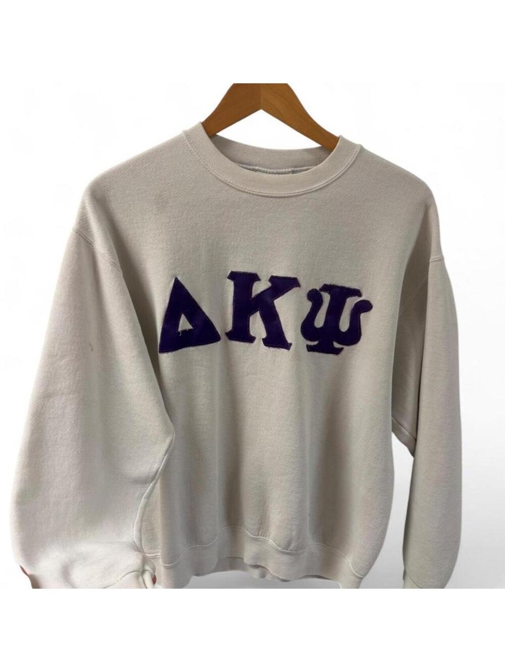 Lee Delta Kappa Psi white crewneck sweatshirt with purple Greek letters, size M